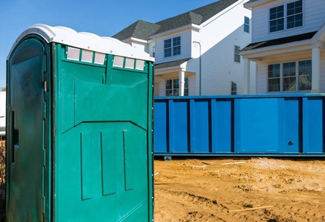 a row of portable toilets at a construction site